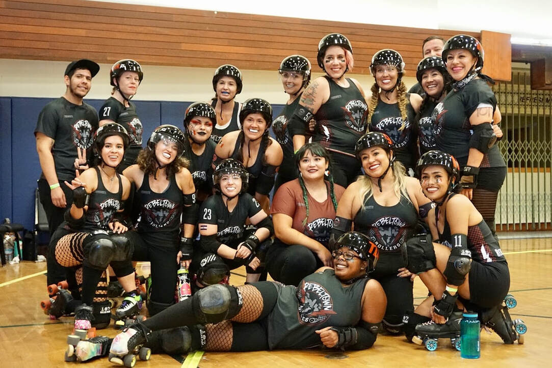 RebelTown Rollers, a women's flat track roller derby team based in Lynwood, CA, poses for a photo at the Culver City Auditorium.